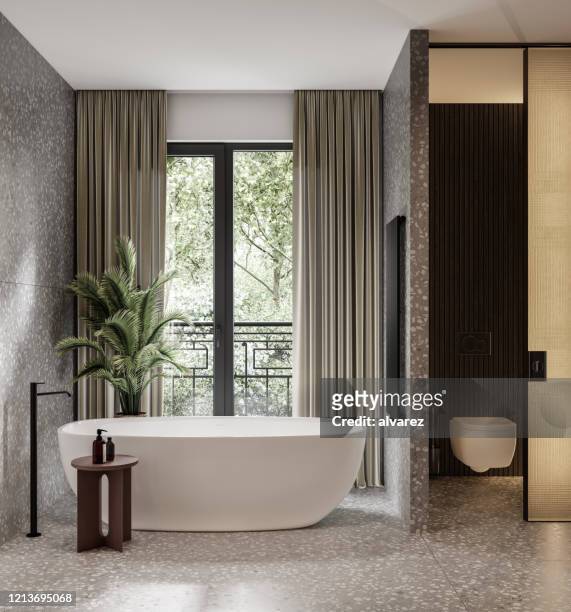 large bathroom with a bathtub - domestic bathroom stock pictures, royalty-free photos & images