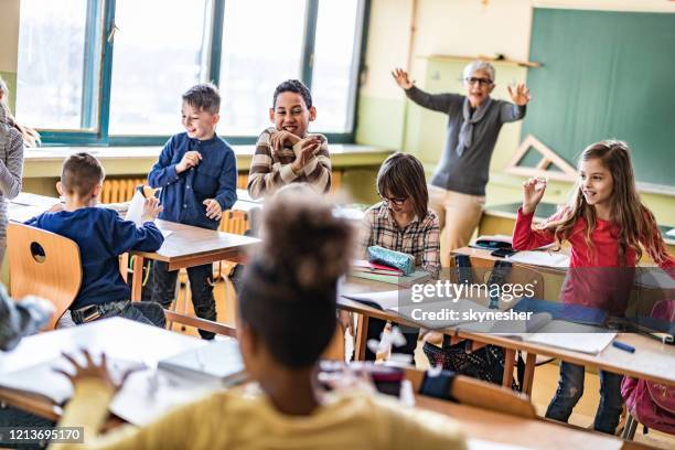 chaos in the classroom of elementary school! - naughty in class stock pictures, royalty-free photos & images