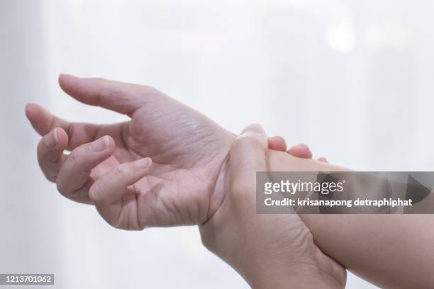 woman hand pain. - human body part stock-fotos und bilder