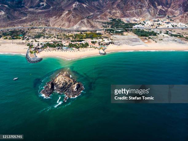 fujairah sandy beach in the united arab emirates - fujairah stock pictures, royalty-free photos & images