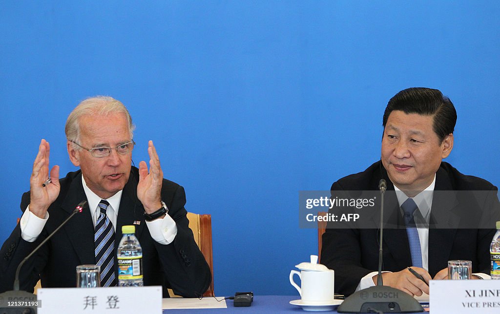 US Vice President Joe Biden (L) speaks a