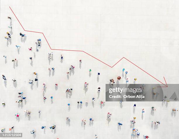 crowd from above forming a falling chart - defeat virus stock pictures, royalty-free photos & images