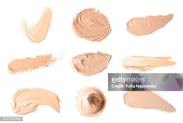 set of smears of liquid powder, cosmetic make up beige liquid foundation smudges range of colors on white background. - smudged stockfoto's en -beelden