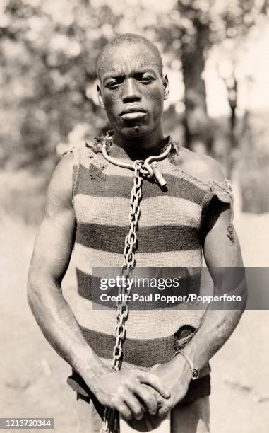 Chained prisoner near Brazzaville in the Congo, circa 1910.