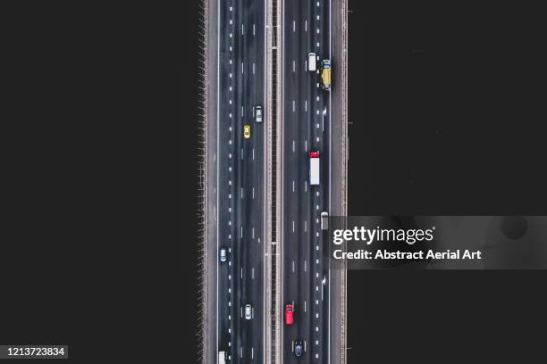 aerial image directly above a highway crossing over a river, amsterdam, netherlands - drone point of view - fotografias e filmes do acervo