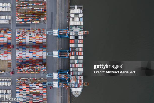 container ship docked in port as seen from above, germany - attraccato foto e immagini stock