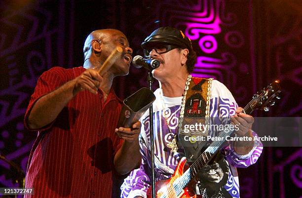 Tony Lindsay and Carlos Santana performing on stage during his 'Shaman' concert tour at Centennial Park on March 27, 2003 in Sydney, Australia.