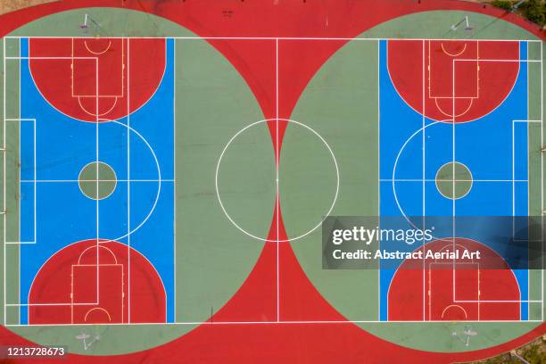 aerial shot directly above two empty sports courts, pamplona, spain - symmetry stock pictures, royalty-free photos & images