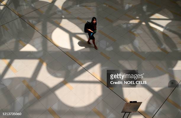 Huawei employee walks along the hallway at the company headquarters in Shenzhen, China's southern Guangdong province on May 19, 2020. - Huawei on May...