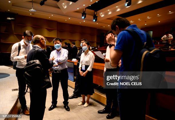 Huawei employees and students listen to a talk during the 5G summit at the Huawei headquarters in Shenzhen in China's southern Guangdong province on...