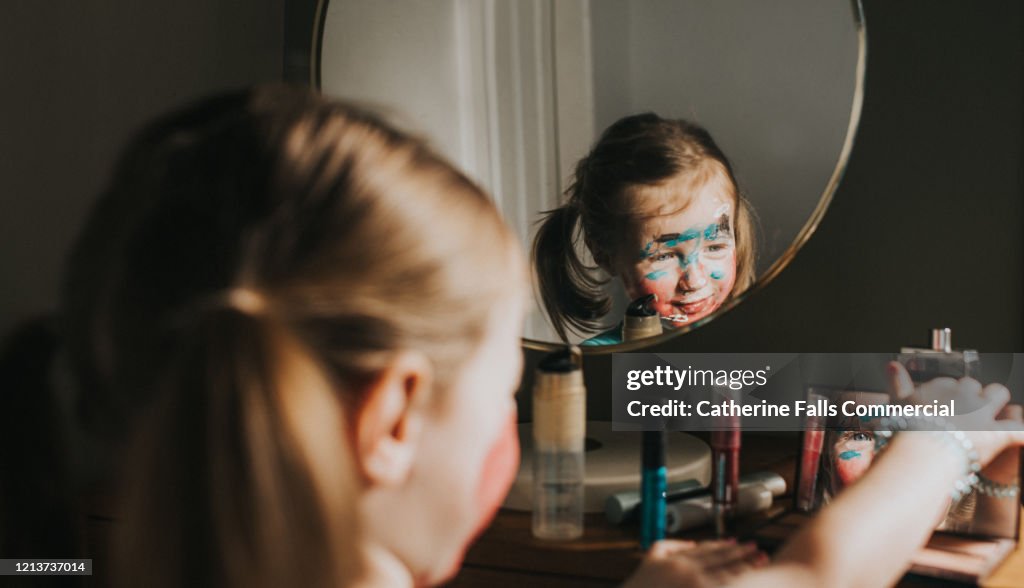 Child playing with Makeup