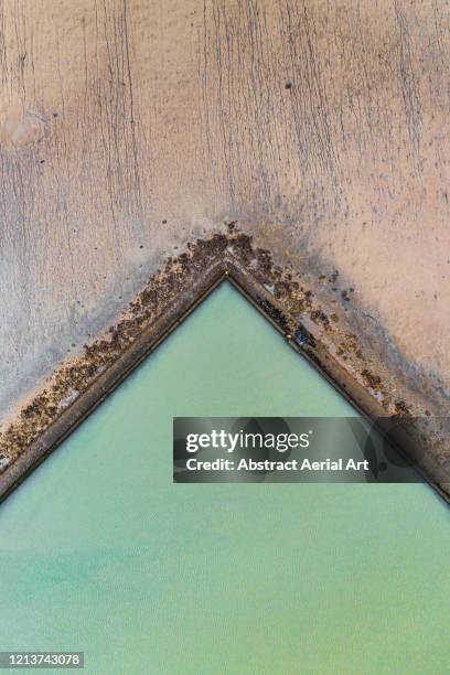 aerial shot above a tidal pool, france - gap france stock-fotos und bilder