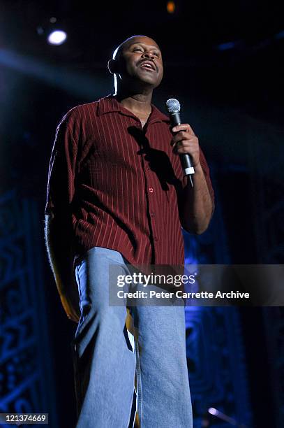 Singer Tony Lindsay performing on stage with Carlos Santana during his 'Shaman' concert tour at Centennial Park on March 27, 2003 in Sydney,...