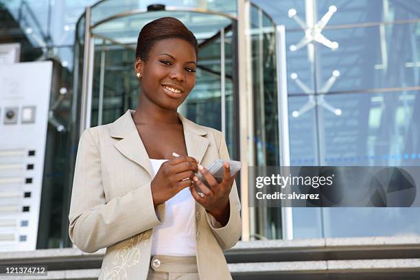 friendly afro american woman - administrative professional stock pictures, royalty-free photos & images