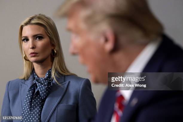 President Donald Trump speaks as his daughter and senior adviser Ivanka Trump looks on during a news briefing on the latest development of the...