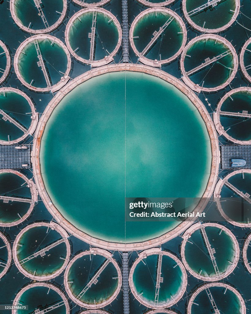 Close up aerial shot of a strange aquaculture structure in a lake, Germany