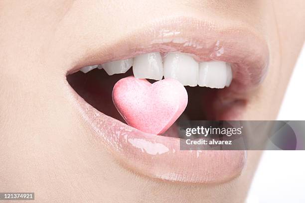 heart in mouth - candy lips stock pictures, royalty-free photos & images