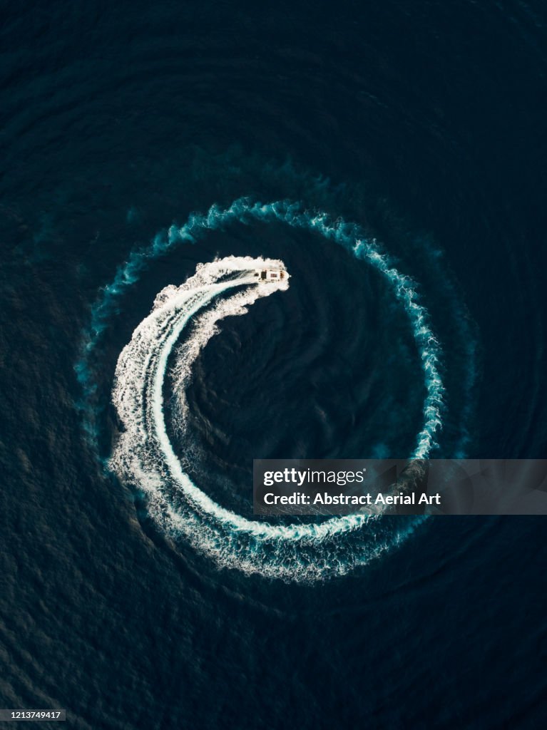 Aerial view of a motorboat circling in the ocean, Monaco
