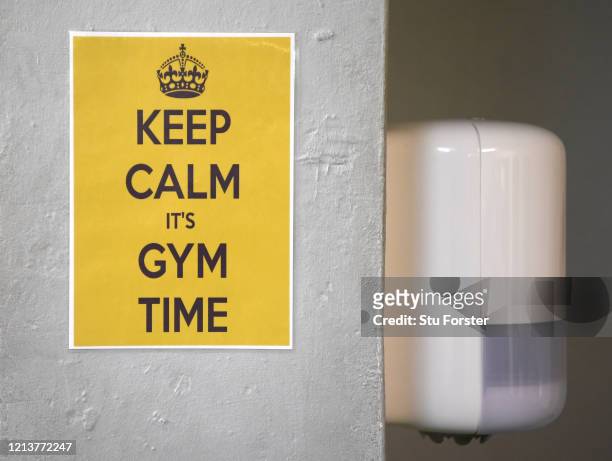 Detail picture of a notice entitled 'Keep Calm it's Gym Time' on a normally busy friday night after owner Mered Pryce allowed members to foster...