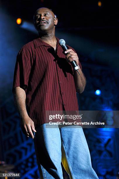 Singer Tony Lindsay performing on stage with Carlos Santana during his 'Shaman' concert tour at Centennial Park on March 27, 2003 in Sydney,...