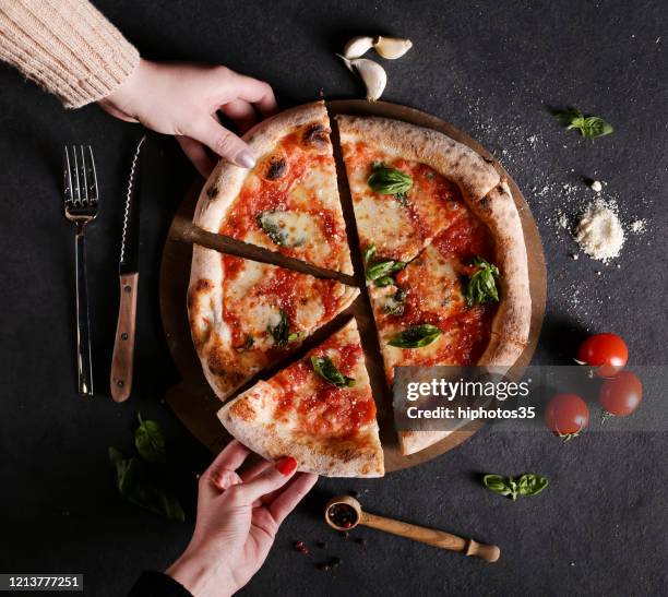 friends sharing a pizza - pizza directly above stock pictures, royalty-free photos & images