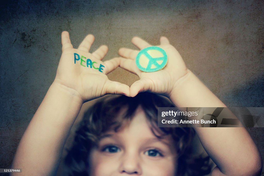 Boy raising hands