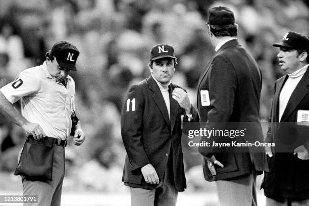 Umpires Randy Marsh, Ed Montague, Lee Weyer and Harry Wendlestedt meet during a game at Dodger Stadium, Los Angeles, California.