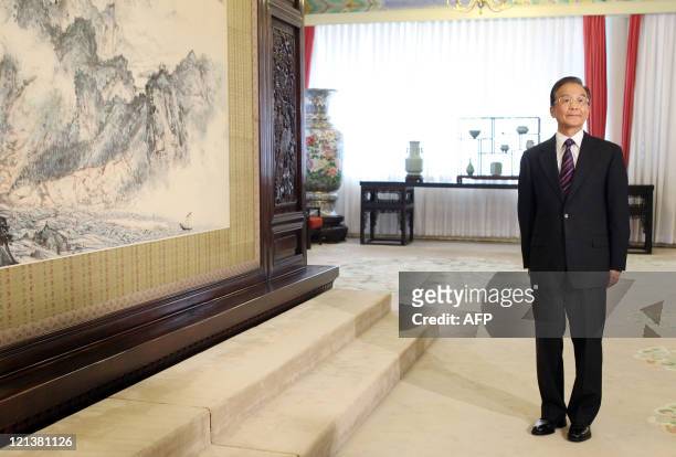 Chinese Premier Wen Jiabao waits for US Vice President Joe Biden to arrive before their meeting at the Zhongnanhai leaders' compound in Beijing on...