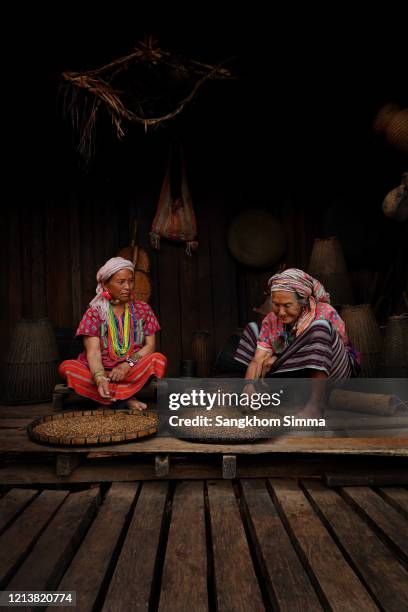 the old female karen hill tribe. - thai tradition stock pictures, royalty-free photos & images