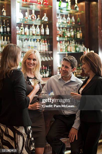 business people in hotel bar - 4 cocktails stock pictures, royalty-free photos & images