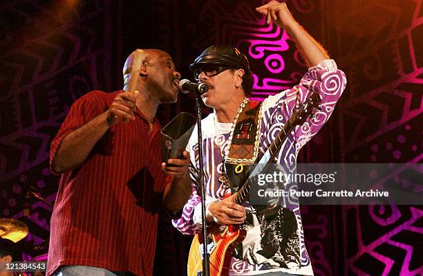 Tony Lindsay and Carlos Santana performing on stage during his 'Shaman' concert tour at Centennial Park on March 27, 2003 in Sydney, Australia.