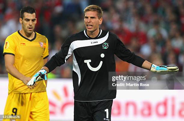 Ron Robert Zieler, goalkeeper of Hannover gestures during the UEFA Europa League play-off match between Hannover 96 FC Sevilla at AWD Arena on August...