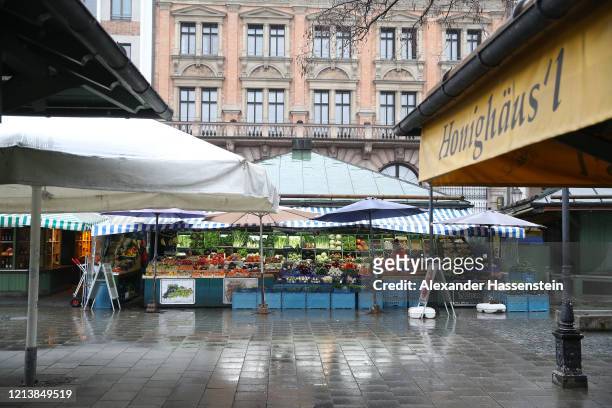 The Viktualienmarkt, a daily food market and a square in the center of Munich, normally a magnet for tourists, stands nearly empty on the first day...