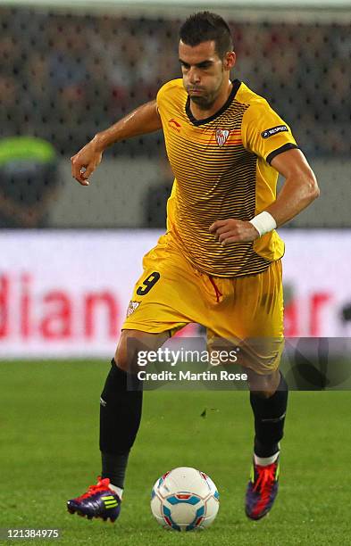 Alvaro Sanchez Negredo of Sevilla runs with the ball during the UEFA Europa League play-off match between Hannover 96 FC Sevilla at AWD Arena on...