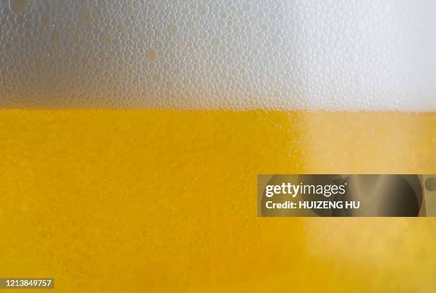 close-up of a glass of beer with bubbles - beer white background stock pictures, royalty-free photos & images