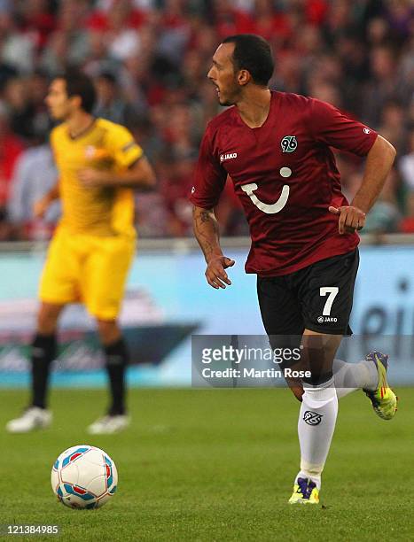 Sergio Pinto of Hannover runs with the ball ball during the UEFA Europa League play-off match between Hannover 96 FC Sevilla at AWD Arena on August...