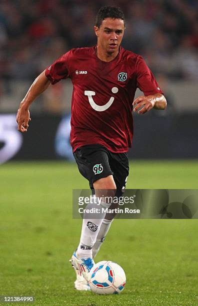 Manuel Schmiedebach of Hannover runs with the ball ball during the UEFA Europa League play-off match between Hannover 96 FC Sevilla at AWD Arena on...