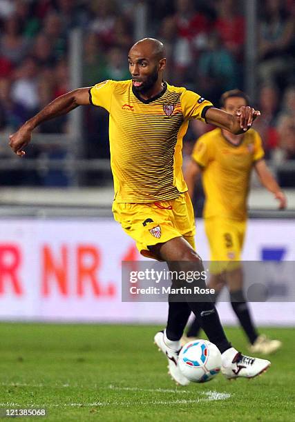 Frederic Kanoute of Sevilla runs with the ball during the UEFA Europa League play-off match between Hannover 96 FC Sevilla at AWD Arena on August 18,...