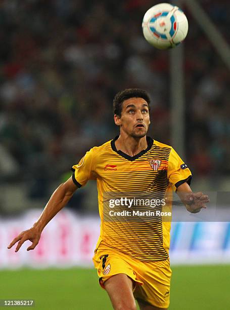 Jesus Navas of Sevilla runs with the ball during the UEFA Europa League play-off match between Hannover 96 FC Sevilla at AWD Arena on August 18, 2011...