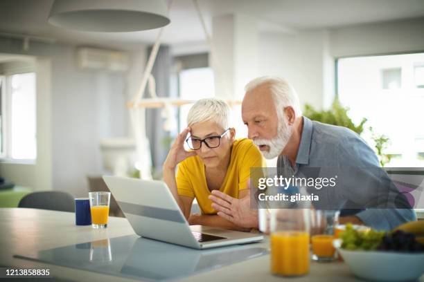 senior couple isolated at home. - shocked stock pictures, royalty-free photos & images