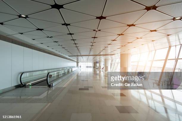 airport escalators - airport corridor stock pictures, royalty-free photos & images