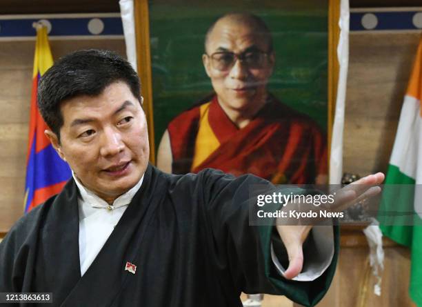 Photo taken on Jan. 17 shows Tibetan government-in-exile Prime Minister Lobsang Sangay giving an interview in Dharamsala, northern India. Seen in the...