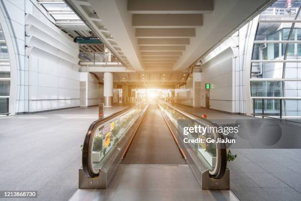 airport escalators - travolator stock pictures, royalty-free photos & images