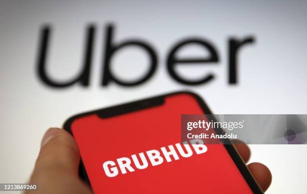 In this illustration photo, Uber and Grubhub logos are displayed on a laptop and a mobile phone screen in Ankara, Turkey on May 19, 2020.