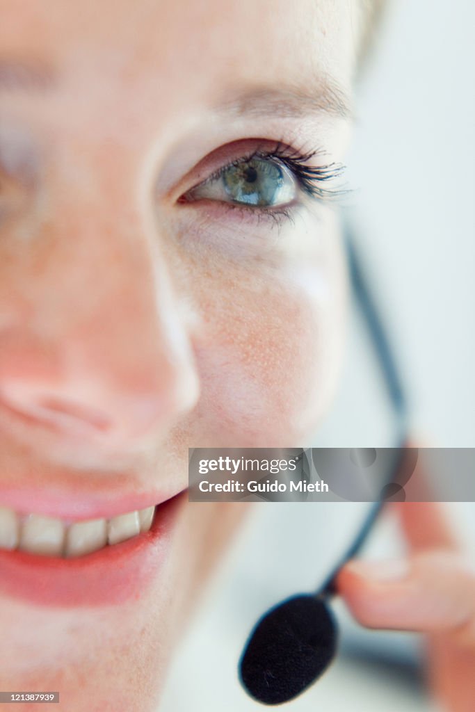 Close up of woman face with headset