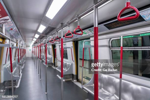 red handle in subway trains cabin - vagone foto e immagini stock