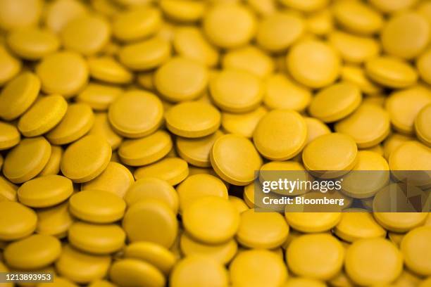 Finished tablets sit inside a packaging machine during the manufacture of the Favipiravir antiviral medicine, a joint venture between the Russian...