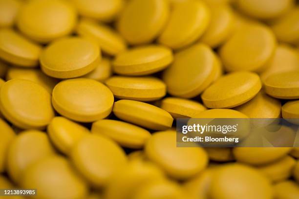 Finished tablets sit inside a packaging machine during the manufacture of the Favipiravir antiviral medicine, a joint venture between the Russian...