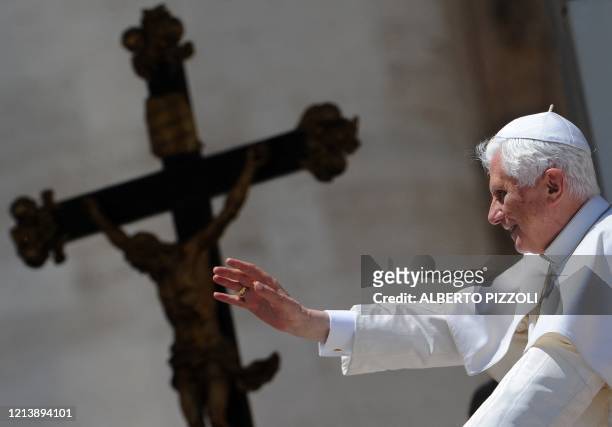 Pope Benedict XVI salutes at the end of his weekly general audience in Saint-Peter's square at the Vatican on May 26, 2010. AFP PHOTO / ALBERTO...