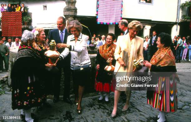 The Spanish Kings of Spain Juan Carlos and Sofia and the Belgian Queen Paola greeting some women in their traditional costumes Caceres, Spain.